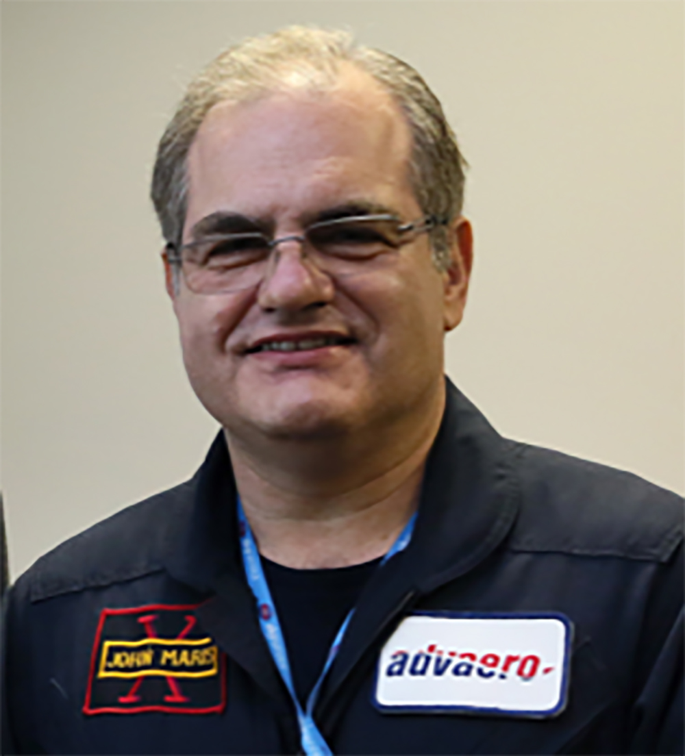 Cropped headshot of Dr John Maris wearing his Advaero uniform and a lanyard