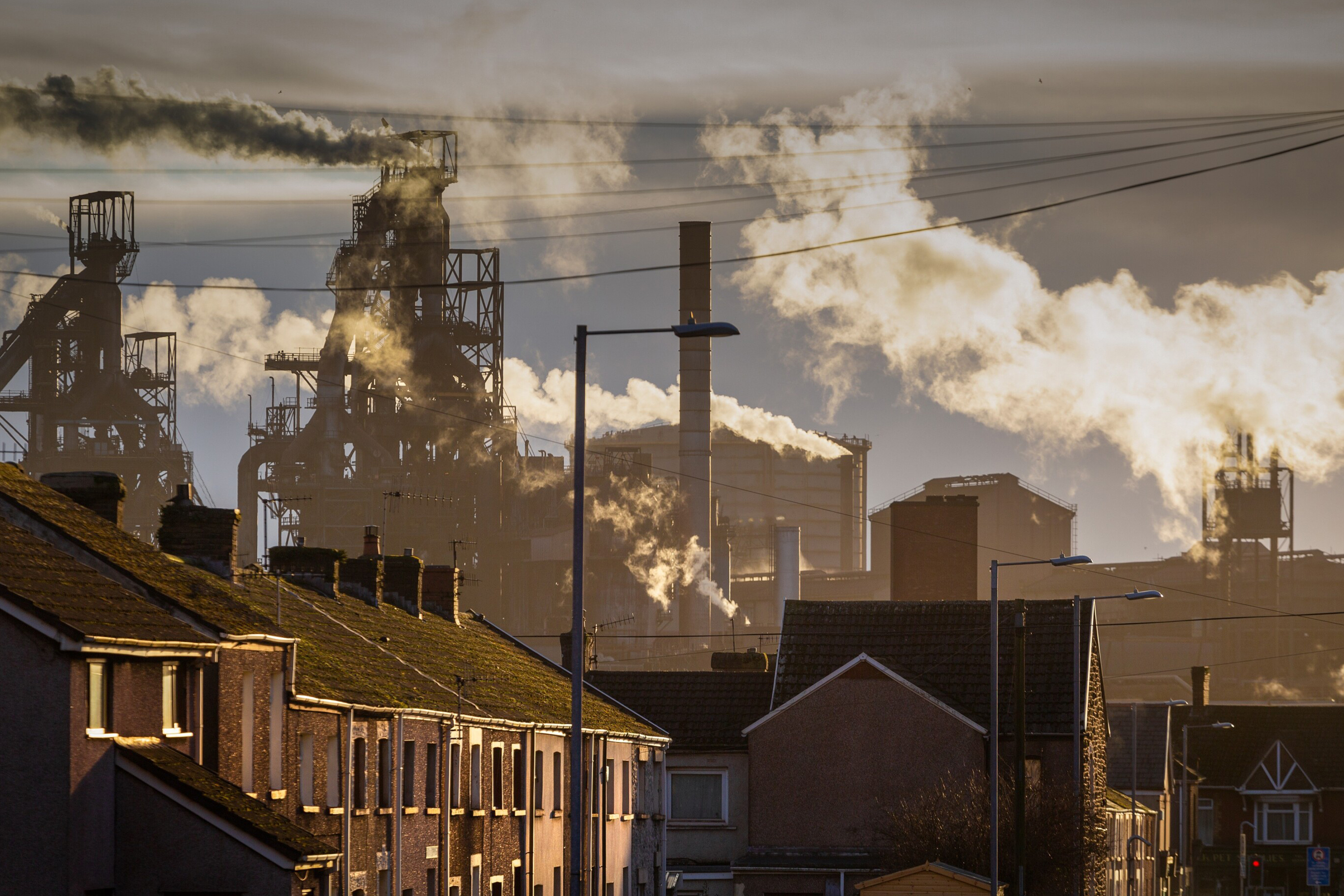A photo of industrial buildings emitting pollution